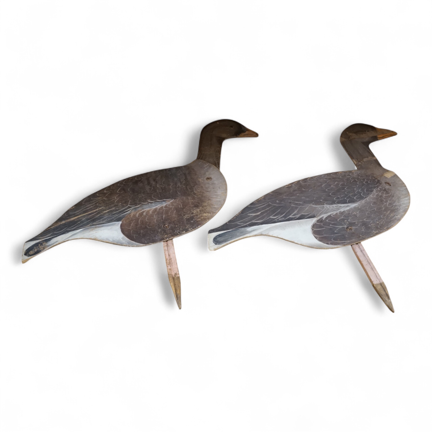 A pair of painted ply 'goose' profile decoys, 58cm high